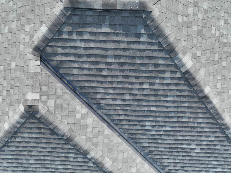 Close aerial of the finished roof where the hip, ridge and valley lines meet